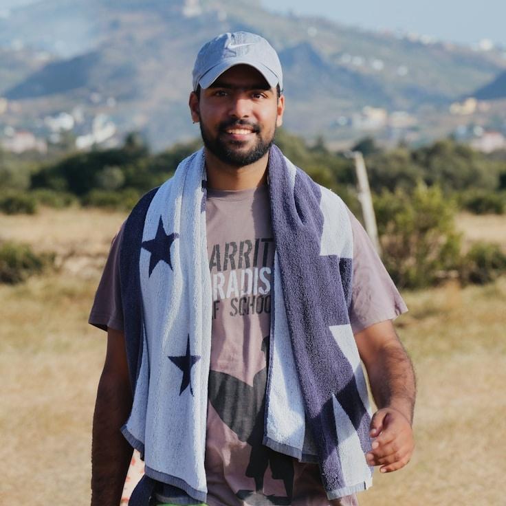 Kaveri Mehta, Lead Design Curator at OakMeadowLab, reviewing corporate floral arrangements